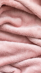 Soft pink fleece blanket fabric texture, cozy home textile background © MariiaDemchenko