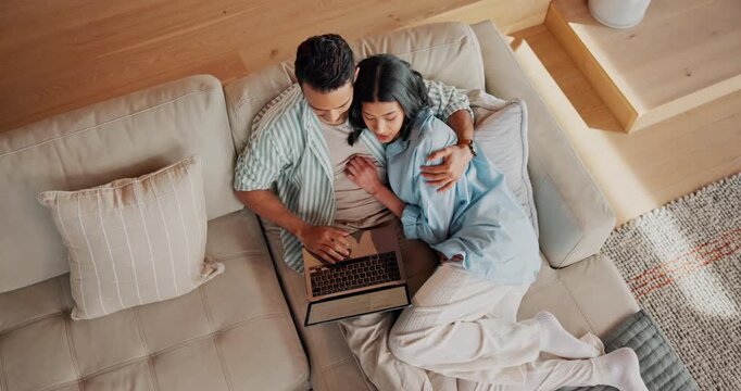 Laptop, hug and couple on sofa in house with bonding, connection and affection in marriage together. Happy, computer and woman embracing man in living room for support in relationship in apartment.