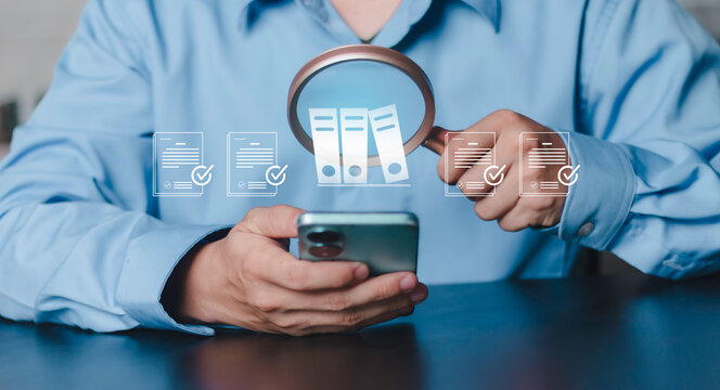 Financial audit concept, Budget, accounting review, business inspection, data verification, check income and expenses. Magnifying glass focusing on document file icon