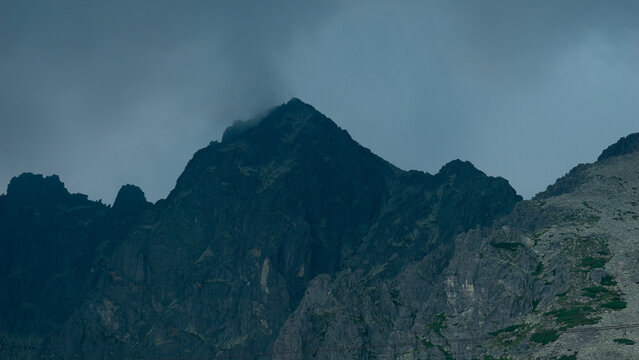 carpathians lomnicky stit peak high tatras mountains stormy dark sky cloudy weather atmosphere dramatic landscape nature exploration tourism concept of weather, travel, adventure, climate, environment