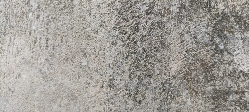 Coarse concrete texture surface with speckled dark grain details, ideal for industrial backgrounds, architectural layouts, modern web banners, and realistic material 3D renders