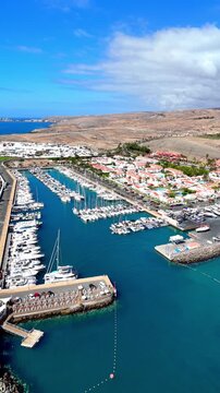 Aerial view flying over puerto de mogan marina
