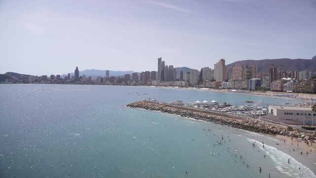View of sea and hotels and high rise buildings lining coastline of Platgeta del Mal Pas sandy beach, Benidorm, Alicante Province, Costa Blanca, Spain