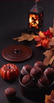 Halloween chocolate muffins and autumn decorations