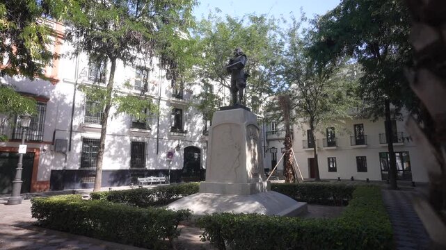 View of Zurbaran statue in Plaza de Pilatos on a sunny day, Seville, Andalusia, Spain