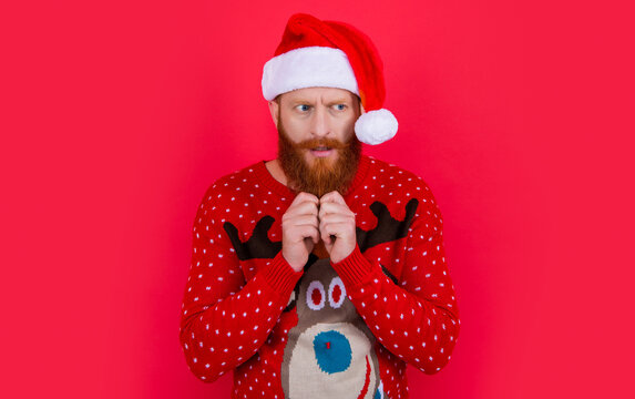 scared and pondering xmas man in santa hat. merry xmas. bearded santa man on xmas holiday