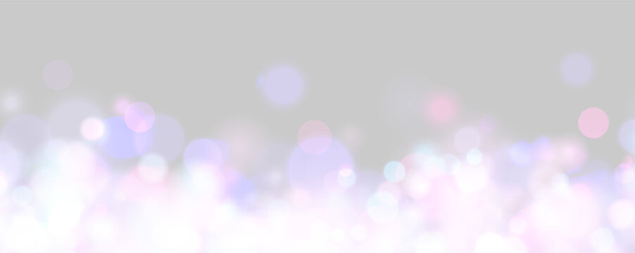 Glowing multicolored bokeh lights create a dreamy and vibrant atmosphere on a black background. Soft circles of blue, pink, purple, and white shimmer with gentle intensity.