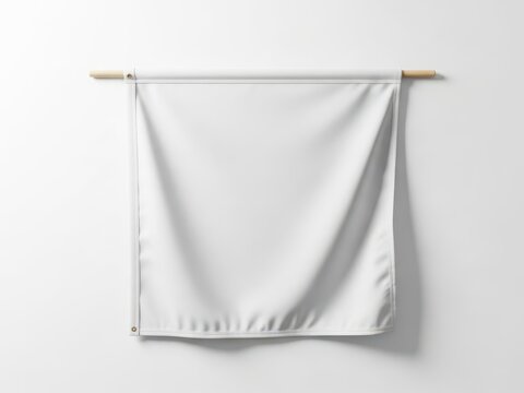 Plain white flag hanging on wooden rods