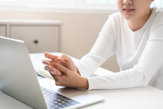 Health care and medical concept, rheumatism asian woman hand pain from cramp, trigger finger, wrist pain touching massaging, hand holding ache joint, arthritis inflammation.Chronic disease from injury