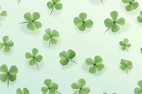 Four leaf clovers floating over a light green background, symbolizing luck and nature