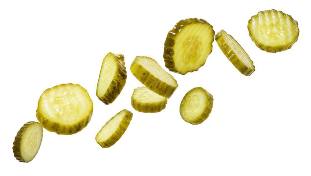 Sliced pickled cucumbers falling and floating in midair as isolated on transparent background