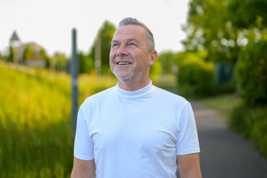 Optimistic Senior Man Looking Up