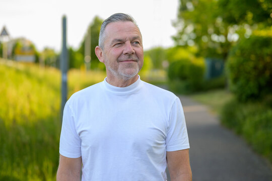 Confident Senior Man Winking Outdoors