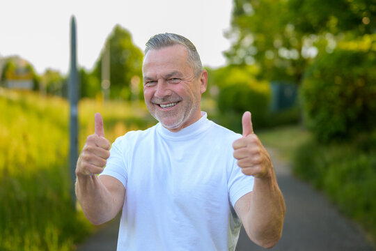Happy Senior Showing Thumbs Up