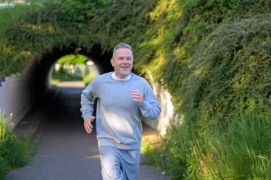 Senior Man Running Near Tunnel