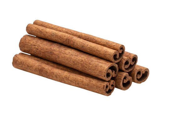 Pile of cinnamon sticks on transparent background