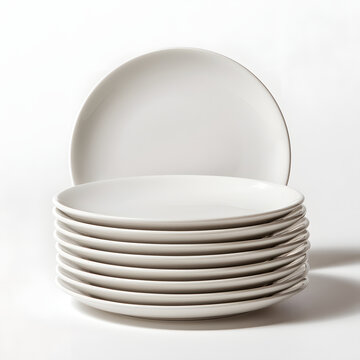 A stack of clean, white ceramic plates, showcasing simplicity and elegance in design.