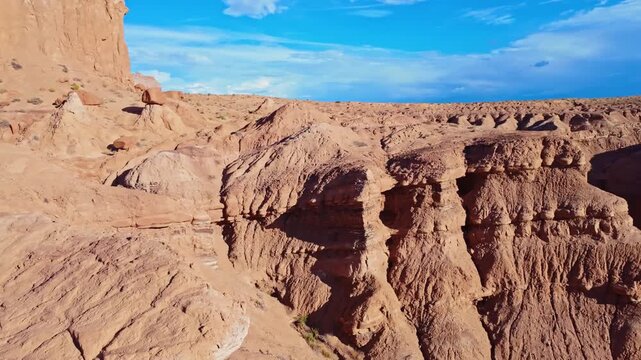 Morning sunlight illuminates unique sandstone  weathered rock formations along the Basilisk Trail in Goblin Valley State Park Utah