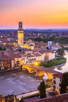 Verona, Italy at sunset with historic bridge over the Adige River