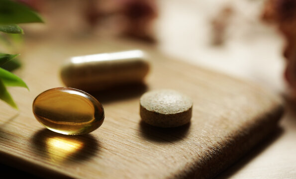pills on a wooden table. Vitamin. Pills. Medicine. Medical. 