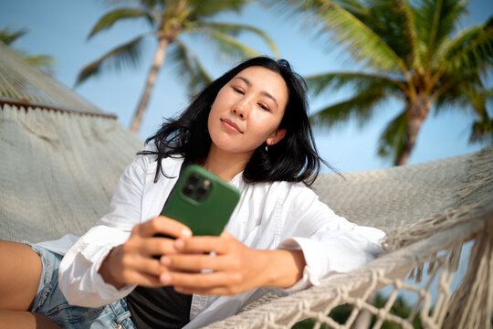Carefree traveler feeling secure and protected while enjoying a dream vacation at a tropical beach