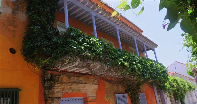 Street in Cartagena, Colombia, a historic walled city, with the houses festooned with plants and flowers