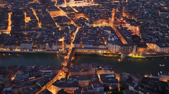 Florence, Italy. Aerial night 4K panoramic drone view of the city at dusk. Majestic view of the ancient city skyline with Basilics, Palazzo Vecchio, bridges, iconic buildings. Europe from above.