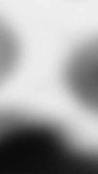Abstract monochrome black and white blurred aura background with frosted glass texture vertical composition perfect for mobile device technology luxury wallpapers.