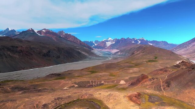 Aerial Drone Landscape of the Rugged Mountains Surrounding Chandratal Lake in Spiti Valley, Himachal Pradesh with Rocky Peaks, Deep Valleys and Dramatic High Altitude Terrain