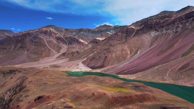 Stunning Aerial Landscape of Chandratal Lake in Spiti Valley with Deep Blue Water, Dramatic Rocky Mountains, High Altitude Desert Terrain and Clear Himalayan Scenery