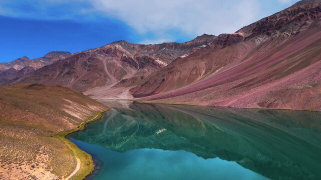 Aerial Drone View of Chandratal Lake in Spiti Valley, Himachal Pradesh with Crystal Blue Water, Rugged Snow Covered Mountains, Rocky Terrain and Vast Himalayan Wilderness