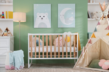Cute baby room interior with comfortable crib, wigwam and other toys © New Africa