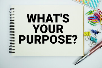 Obraz premium What's Your Purpose? text message written on notepad with stationery flat lay on white background