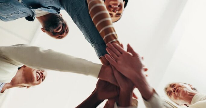 Below, people and hands together in office with celebration, clap and support for work collaboration. Happy, business team and huddle in agency with connection, group synergy or applause for success.