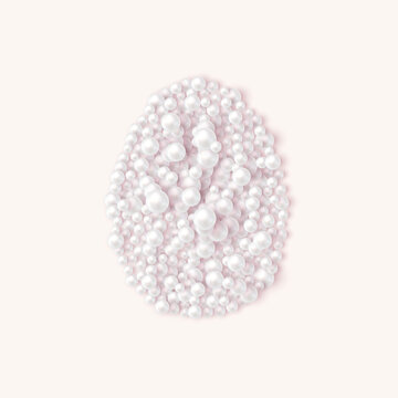 Pearl Easter egg made of white pearls on soft pink background