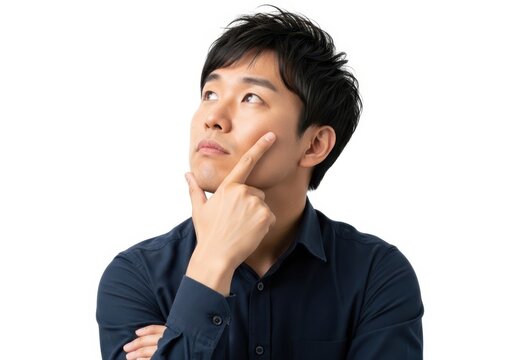 Thoughtful man looking up with hands clasped