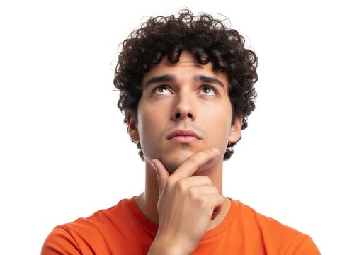 Thoughtful young man looking up with chin resting on hand