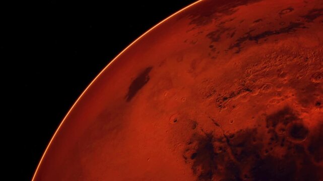 Mars shows its red surface with many craters and valleys. The image shows part of the planet against a black background. This view highlights Mars rocky landforms and colors.