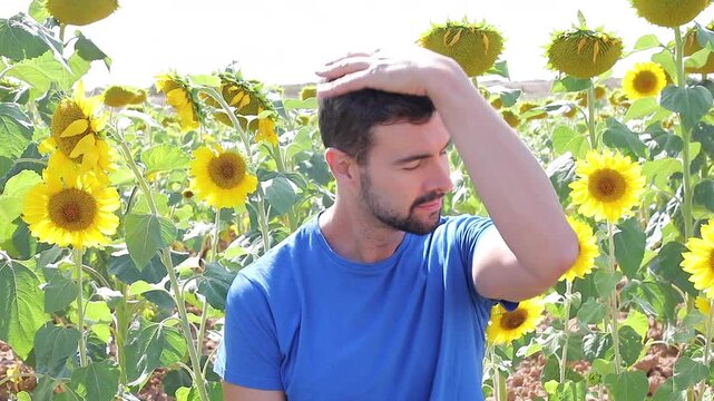 Cute farmer in sunflower field