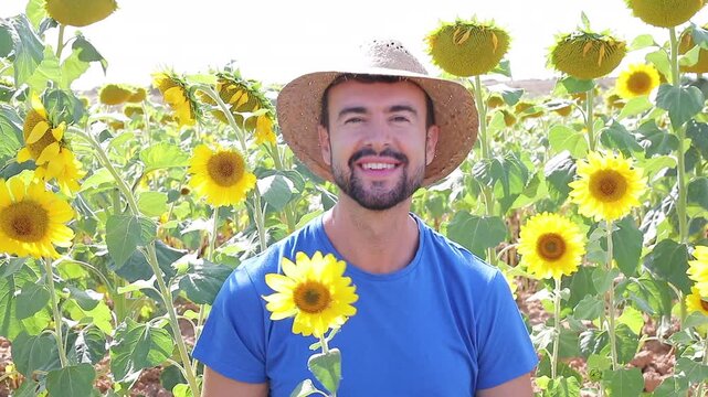 Cute farmer in sunflower field