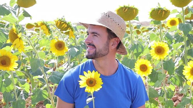 Cute farmer in sunflower field