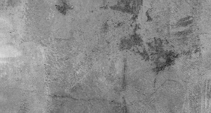 Full frame monochrome grey cement wall texture featuring a rough, uneven surface with subtle scratches and mottled grey tones, ideal for raw industrial architectural backgrounds.