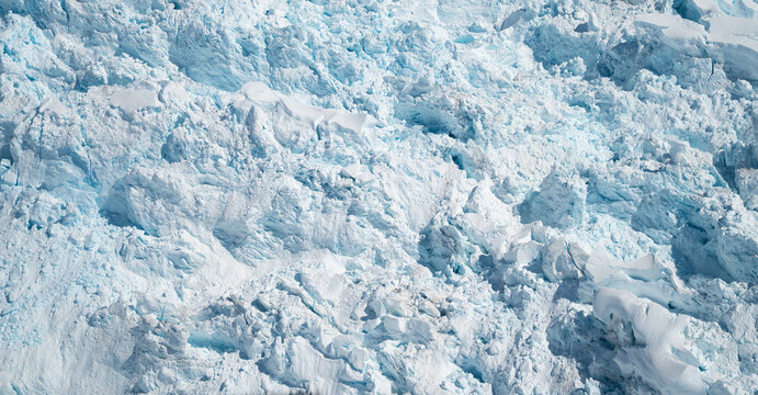 Textured Surface Background of Glacier Ice Formation with Compressed Blue and White Ice in Alaska