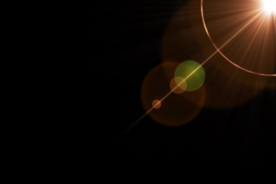 Abstract cinematic lens flare with bright light burst and star rays, isolated on black background. Optical light effect ideal for VFX overlays, transitions, titles and dramatic visual accents.