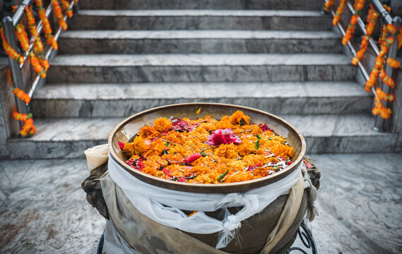 Bright marigold flowers float in a bowl, a in Kathmandu, Nepal