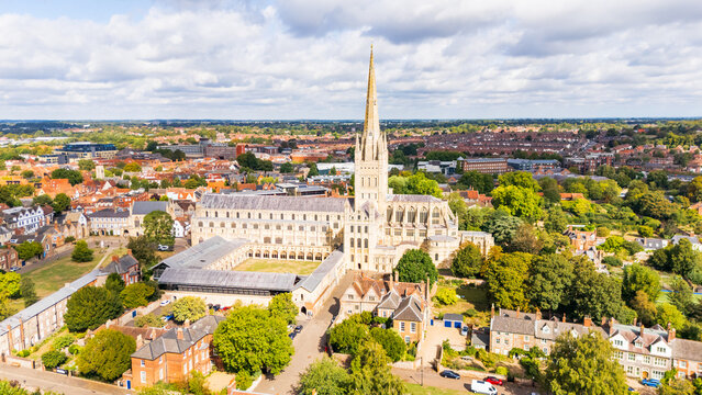 Aerial view of the historical Cathedral in Norwich, Norfolk, UK basked in sunlight