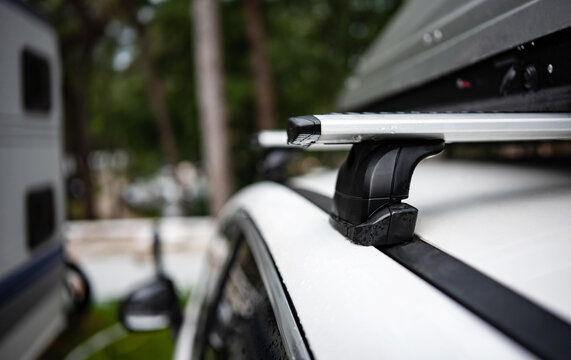 White Car With Roof Rack At Camping Site On A Summer Journey At Nature