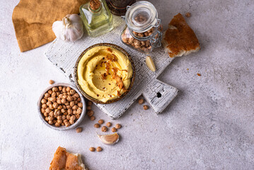 Fototapeta premium Traditional hummus with chickpeas paprika and olive oil. Jewish snack