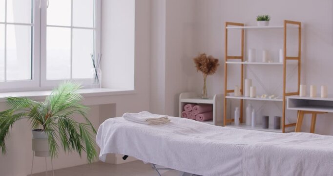 Empty beauty salon or massage office with equipment, showcasing workplace for cosmetology and service in a professional setting prepared for body care and relaxation in a clinic space.