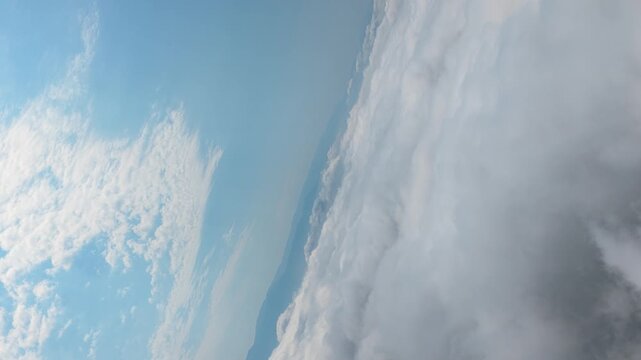 Aerial View of Layered White Clouds Against Blue Sky
